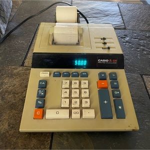 Casio DL-220 printing calculator and unopened package of printing ribbon